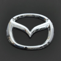 Эмблема для Mazda 626 / 323 пластиковая 63 x 50 мм
