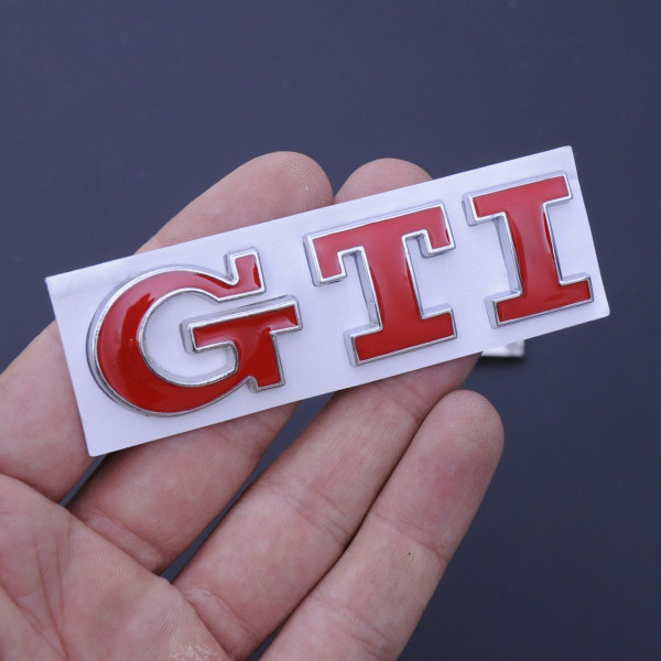 Емблема напис GTI скотч 3М 75 мм металева Польща