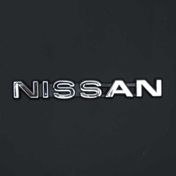 Эмблема надпись Nissan 162 x 21 мм скотч Черный ободок