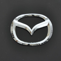 Эмблема для Mazda 626 пластиковая 85 x 65 мм