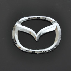 Емблема для Mazda 626 пластикова 85 x 65 мм