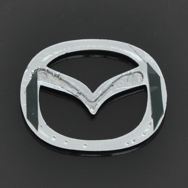 Емблема для Mazda 626 / 323 пластикова 63 x 50 мм