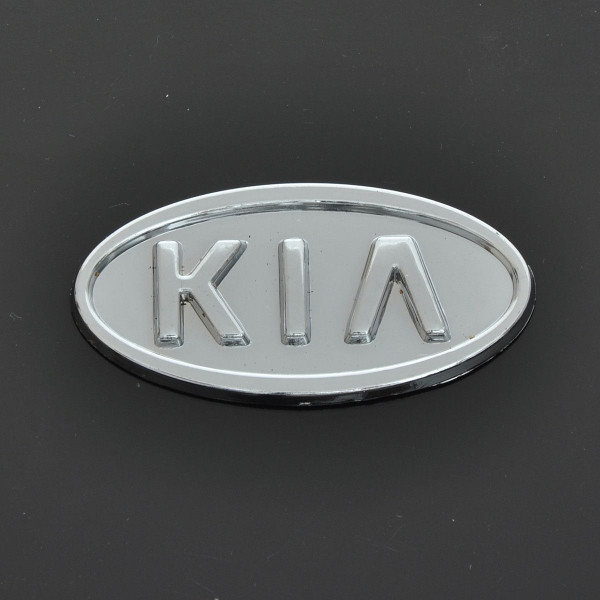 Емблема для Kia Sepia / Rio 90 x 45 мм 3М скотч Xром